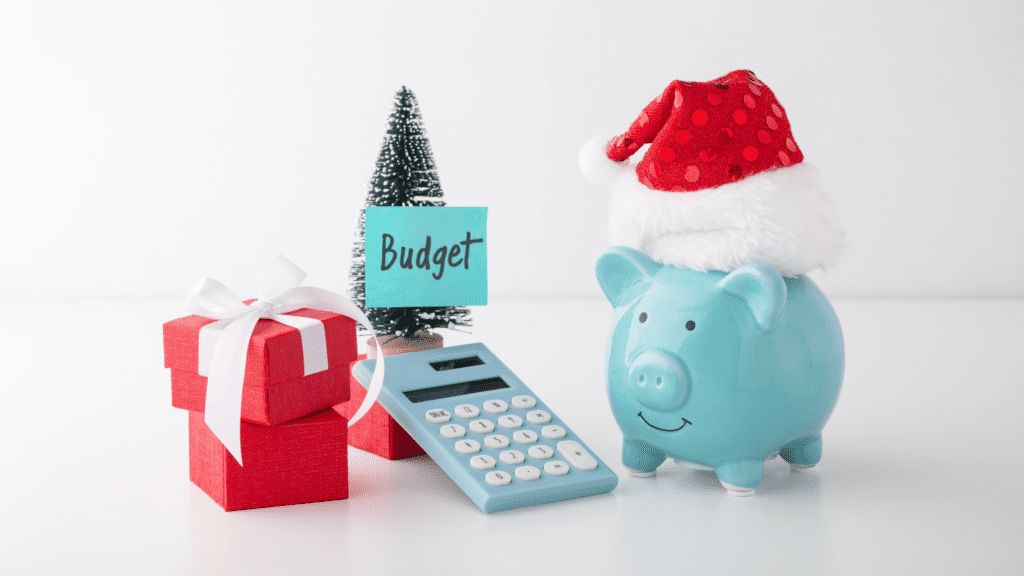 piggy bank with santa hat and Christmas tree