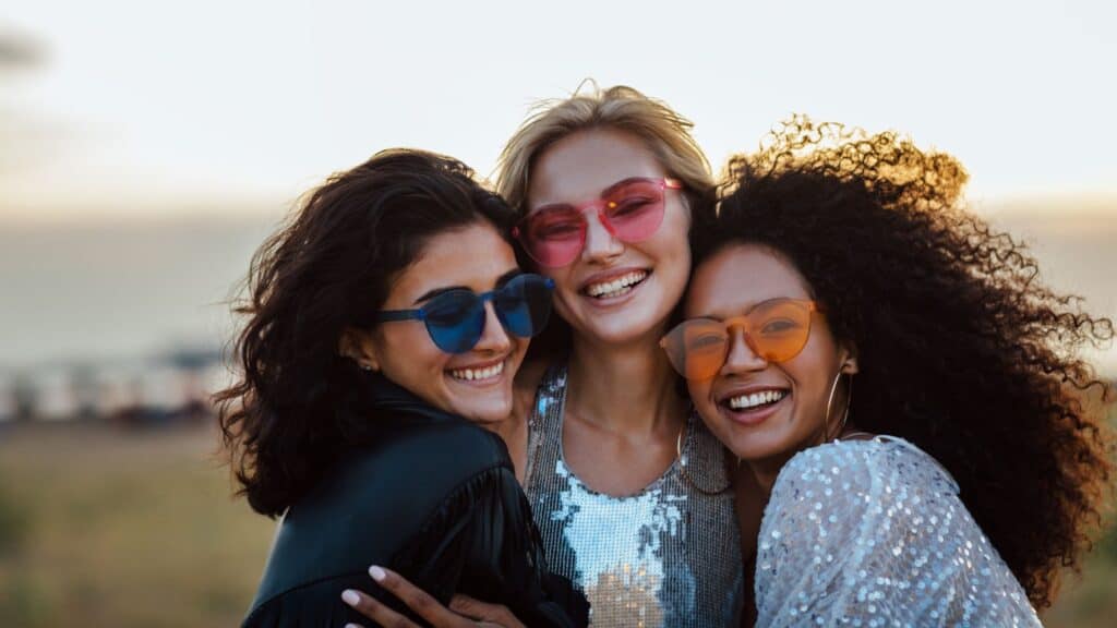 smiling women on a beach