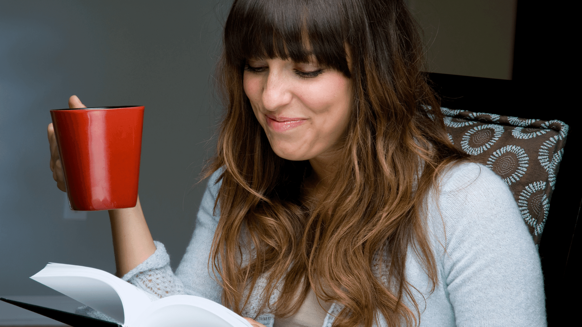 woman drinking coffee and reading the Proverbs Bible reading plan