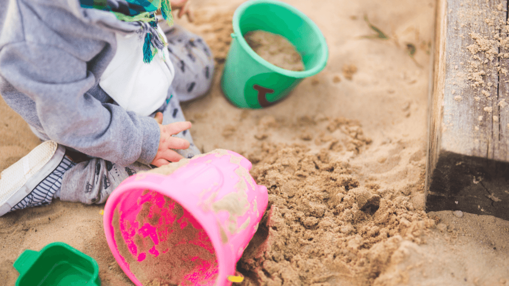 child playing in the sand | have fun with kids