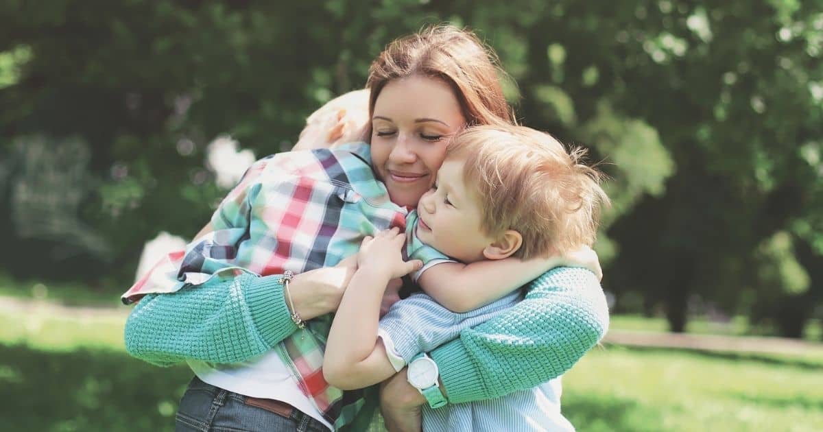 mother hugging young boys | raise gentlemen