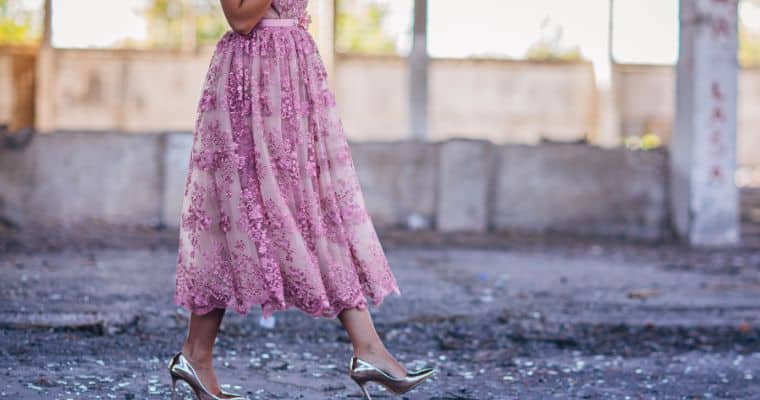 woman wearing pink dress and silver high heeled shoes