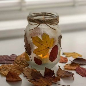 mason jar lantern with leaves