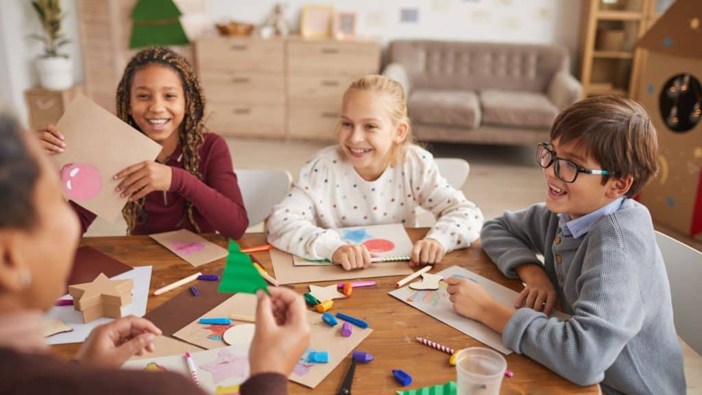 group of kids making fall crafts