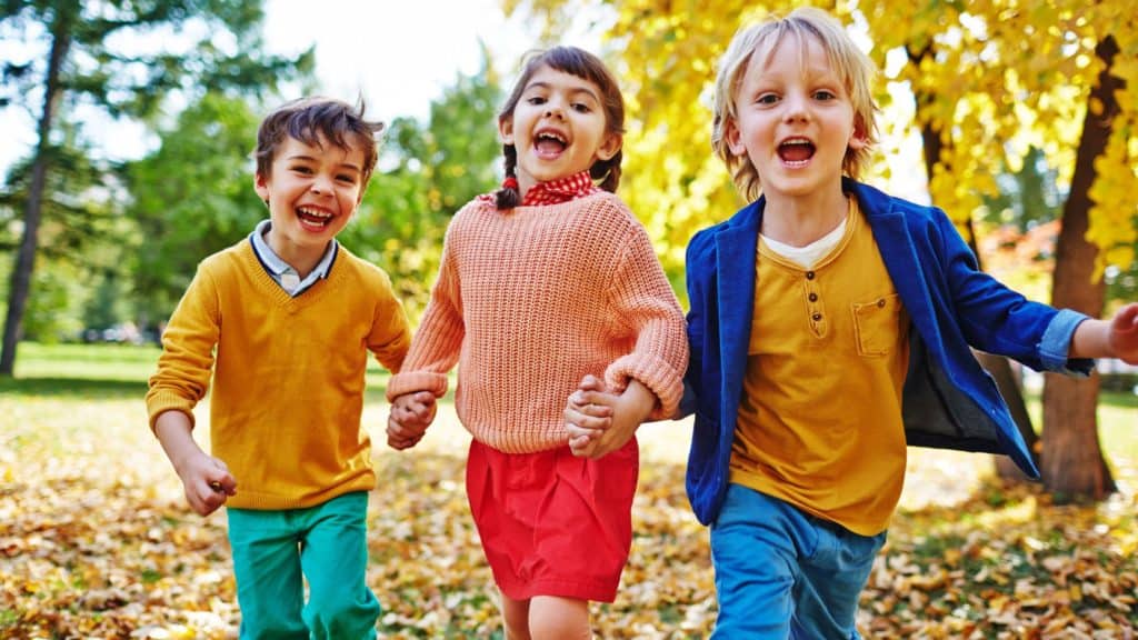 happy kids outside in autumn