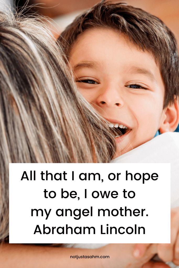 boy hugging his mother and smiling over her shoulder