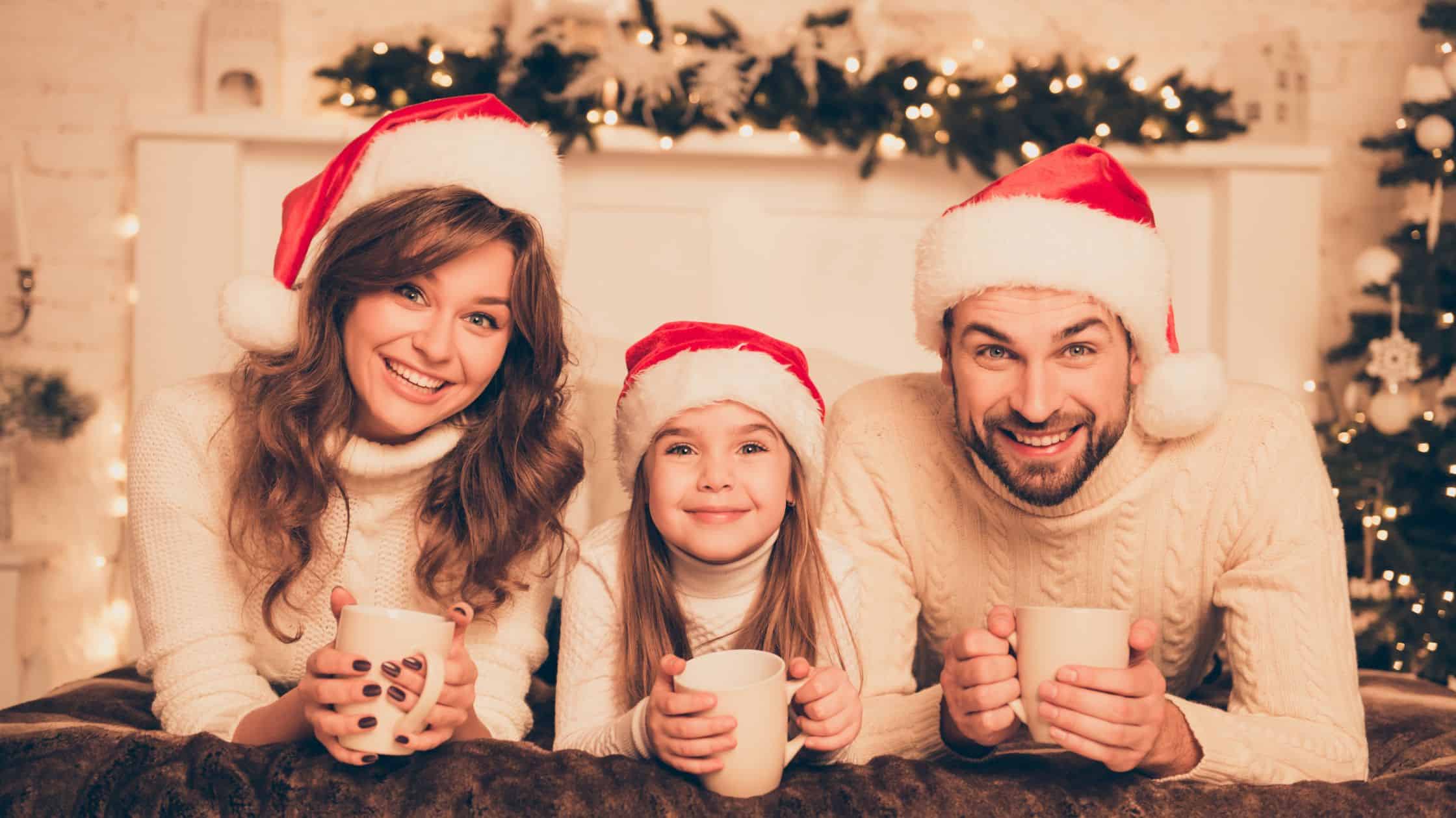 man, woman and girl with hot chocolate