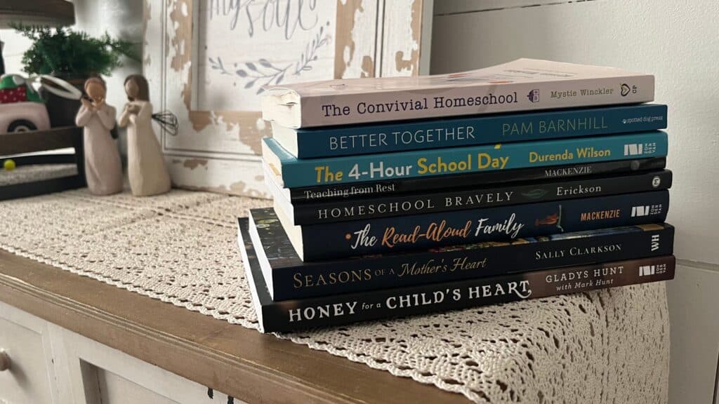 stack of best homeschool books for moms