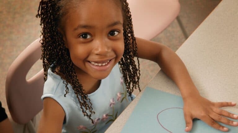 young girl coloring a picture in Sunday School