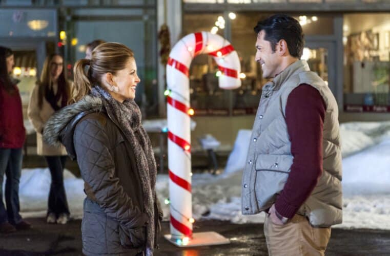 Candace Cameron and costar in Christmas Under Wraps