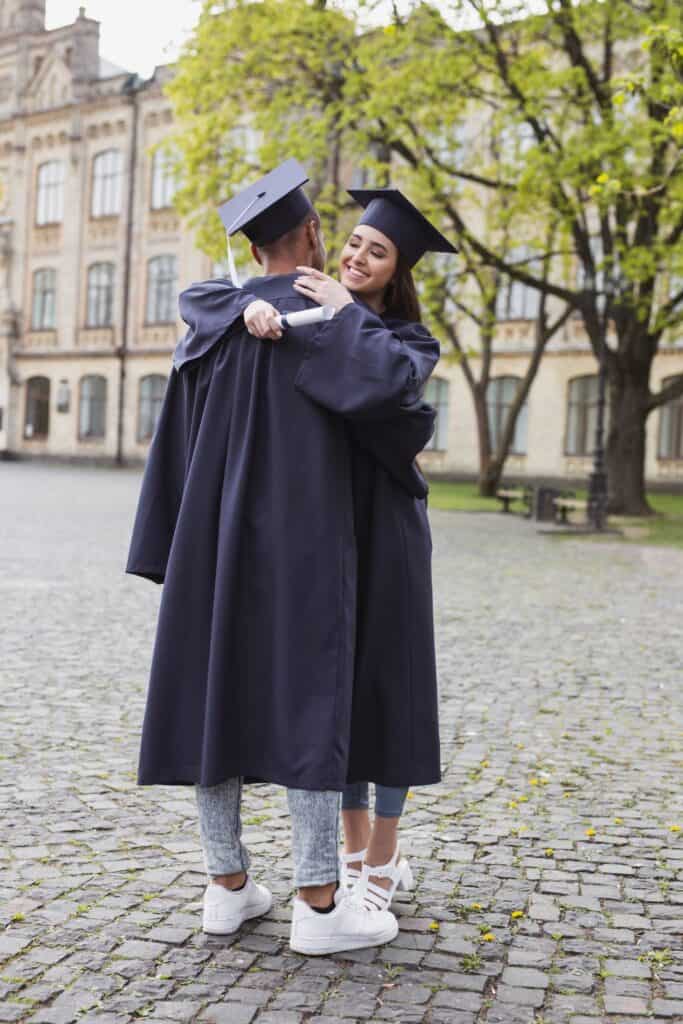 twp graduates hugging