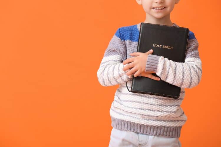 little boy with a bible