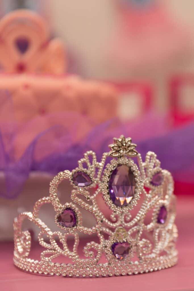 crown covered with pearls and purple stones