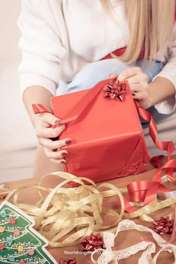 woman wrapping Christmas gifts