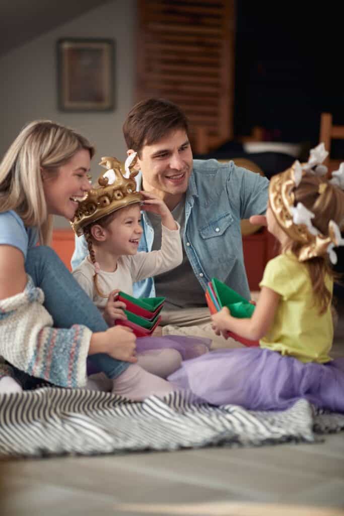 family sitting in the floor playing together