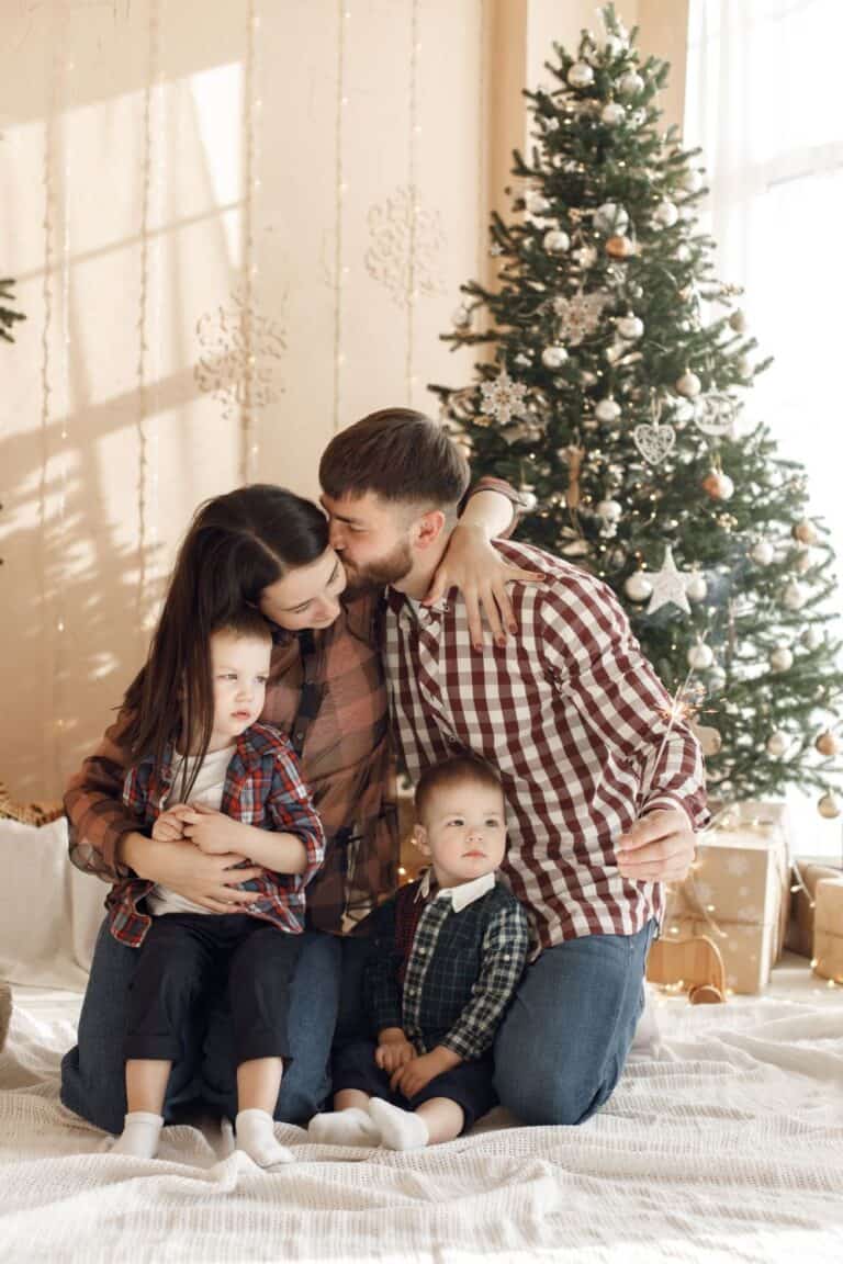 family gathered in front of a Christmas tree