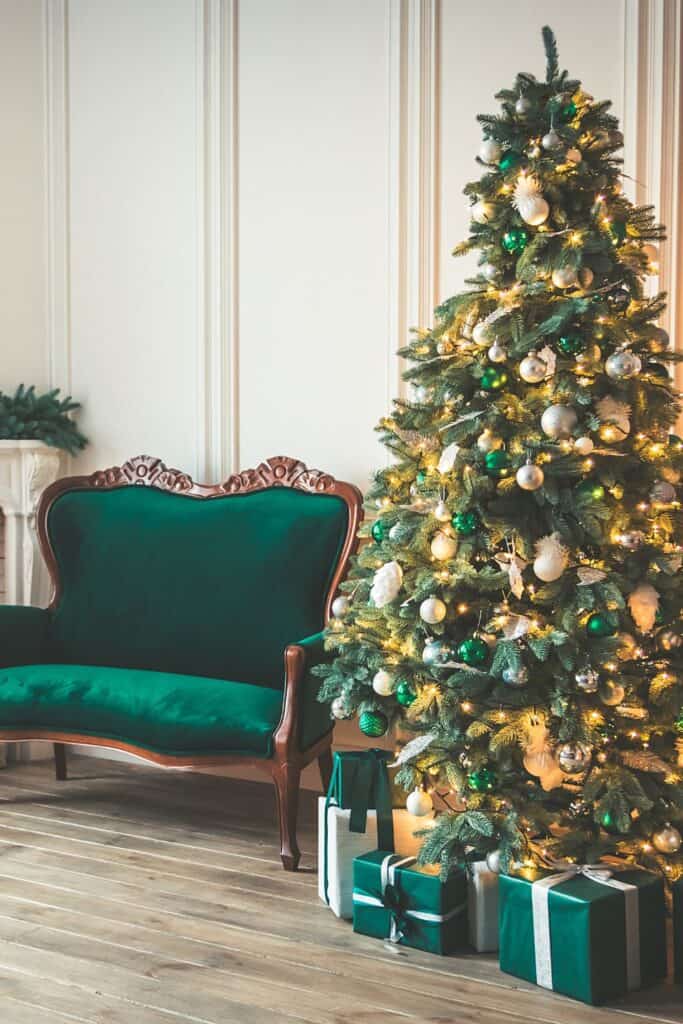 Christmas tree with gifts and a couch