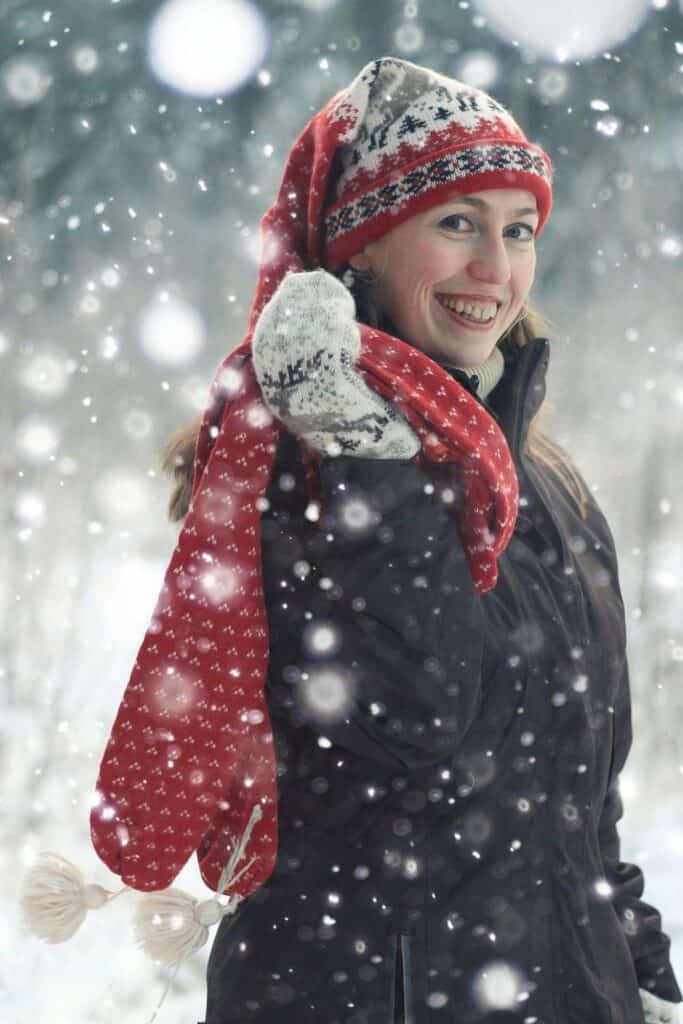 woman outdoors and smiling in the snow