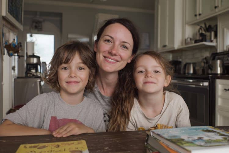woman and her children at the kitchen table