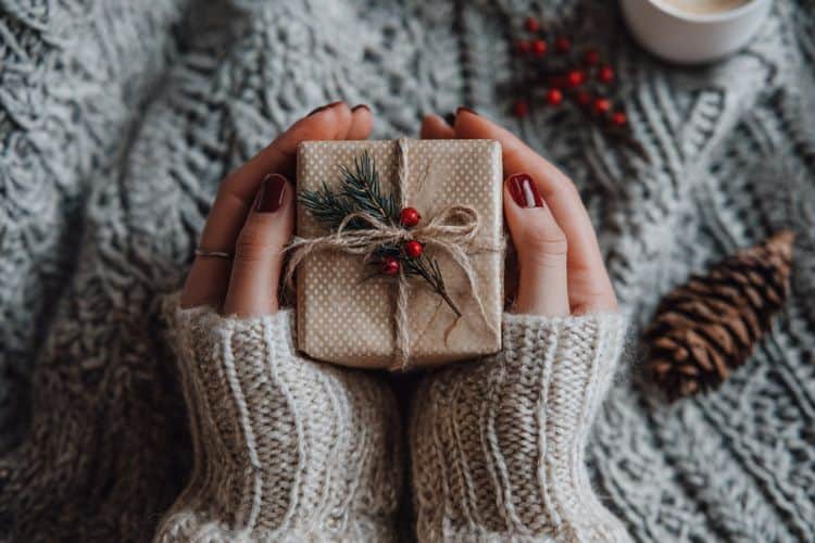 woman's hands holding a gift