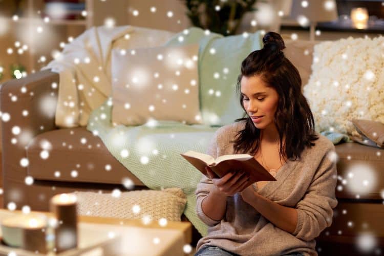 woman reading the Bible in a cozy room