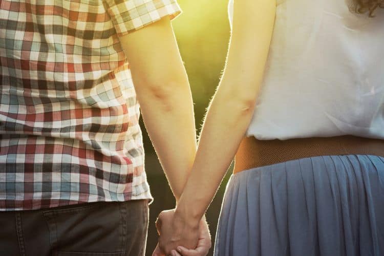 husband and wife holding hands