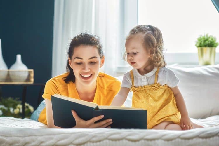 woman and little girl reading the Bible together