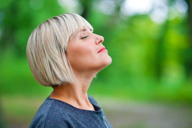 peaceful woman outdoors in nature